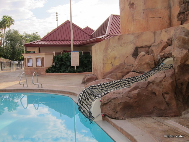 Caribbean Beach Resort, main feature pool slide exit. Note that the slide is netted closed when lifeguards are not on duty. 