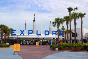 The entrance to Kennedy Space Center Visitor Complex with the Rocket Garden in the back.