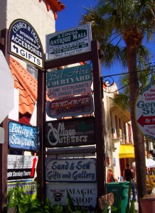 Signs showing a selection of shops in Cocoa Village.