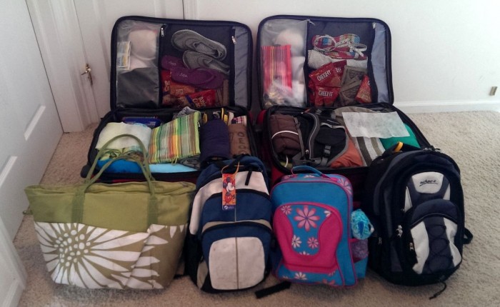 Two checked bags and four carry-ons, ready for our vacation. Perfect for my family of four.
