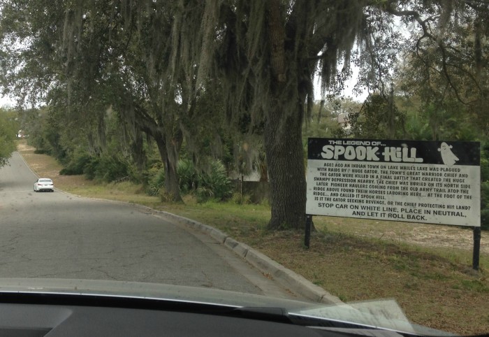 Pulling up to Spook Hill. The car ahead is at the white line where you'll park for your own experience.