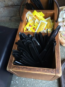 A recent photo at Golden Oak Outpost shows self-serve knives with the blade sides up, which would get dinged by the inspector. 
