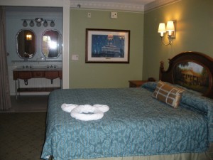 The bedspread are now white with a blue runner.