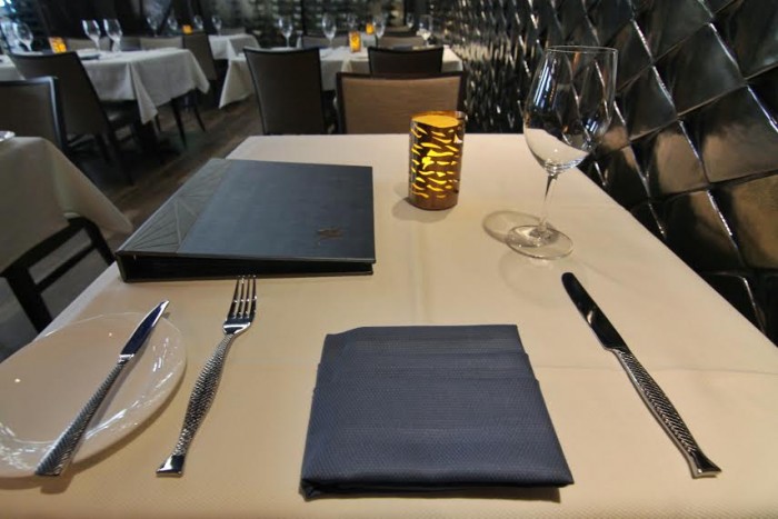 The new tables feature white tablecloths and beautiful fish-shaped silverware.