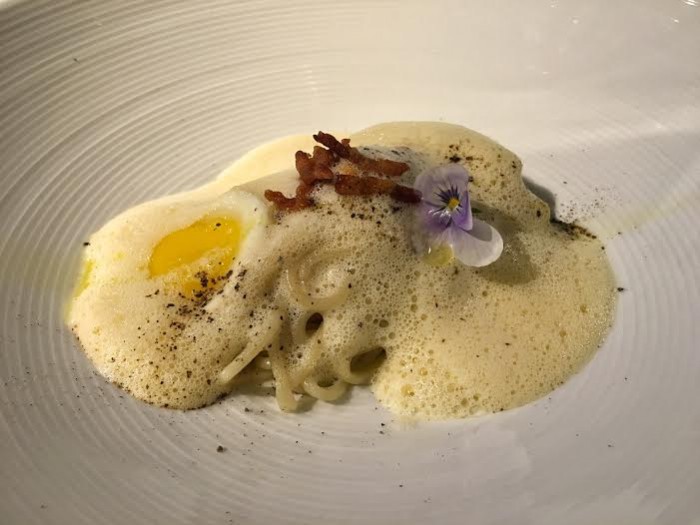 Lo mein 'carbonara' with quail egg and bacon cream foam