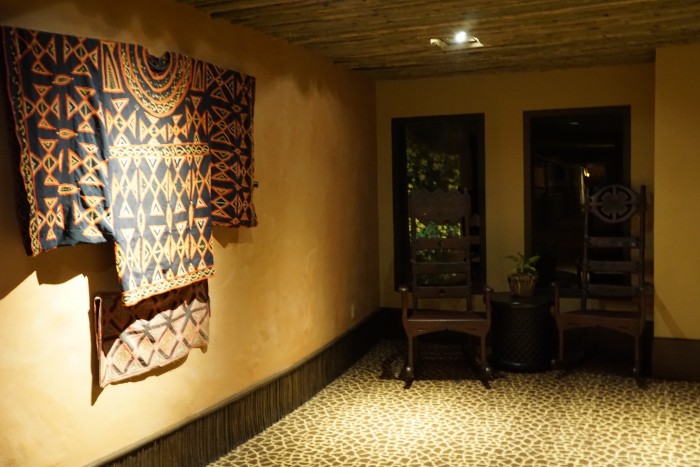 An African garment adorns a corner in one of the hallways of African Kingdom Lodge.