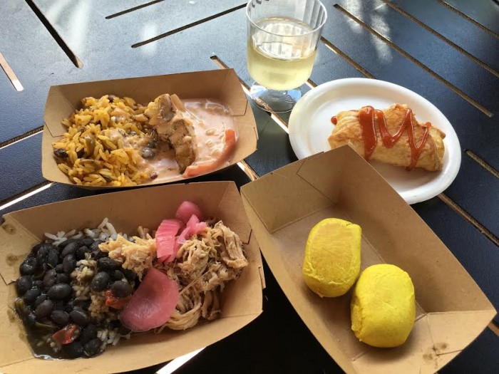 Islands of the Caribbean's Caribbean Sangria, Quesito, Jamaican Beef Patty, Mojo Pork, and Seared Grouper (clockwise from top)