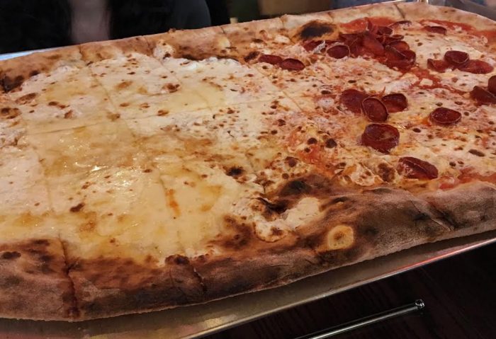 Via Napoli's mezzo metro size pizza with half quattro formaggi and half pepperoni