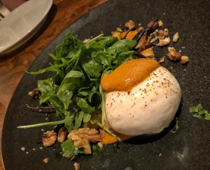 Burrata with romesco sauce, toasted walnuts, and baby carrots
